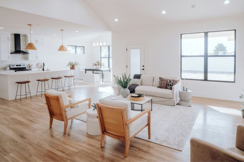 Bright open concept kitchen and living room professionally cleaned by Shiny Cleaning Crew